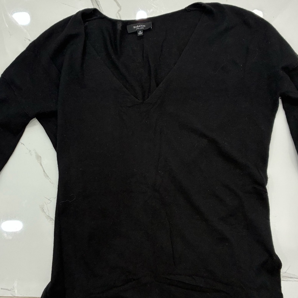 Babaton black linen essential — breathable, effortless, capsule-wardrobe staple”